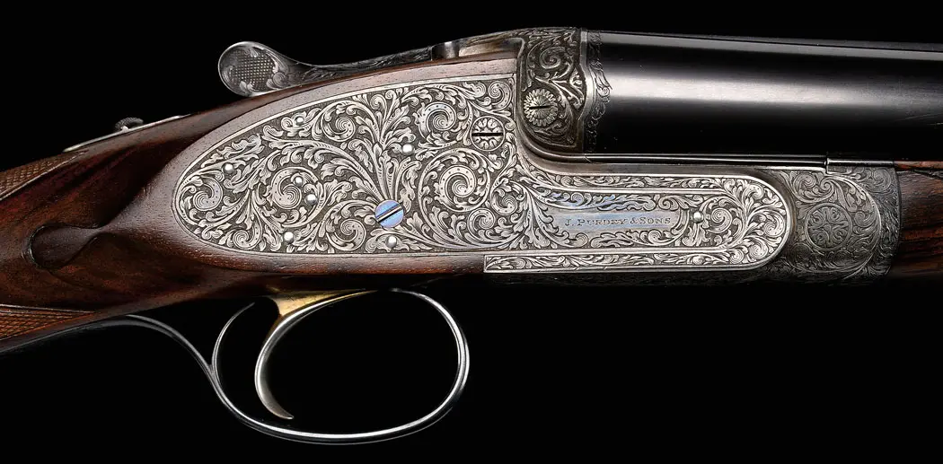 An exquisite Purdey 16-bore extra-finish game gun engraved by Harry Kell.