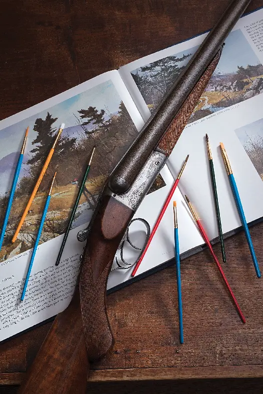 gun with paint brushes