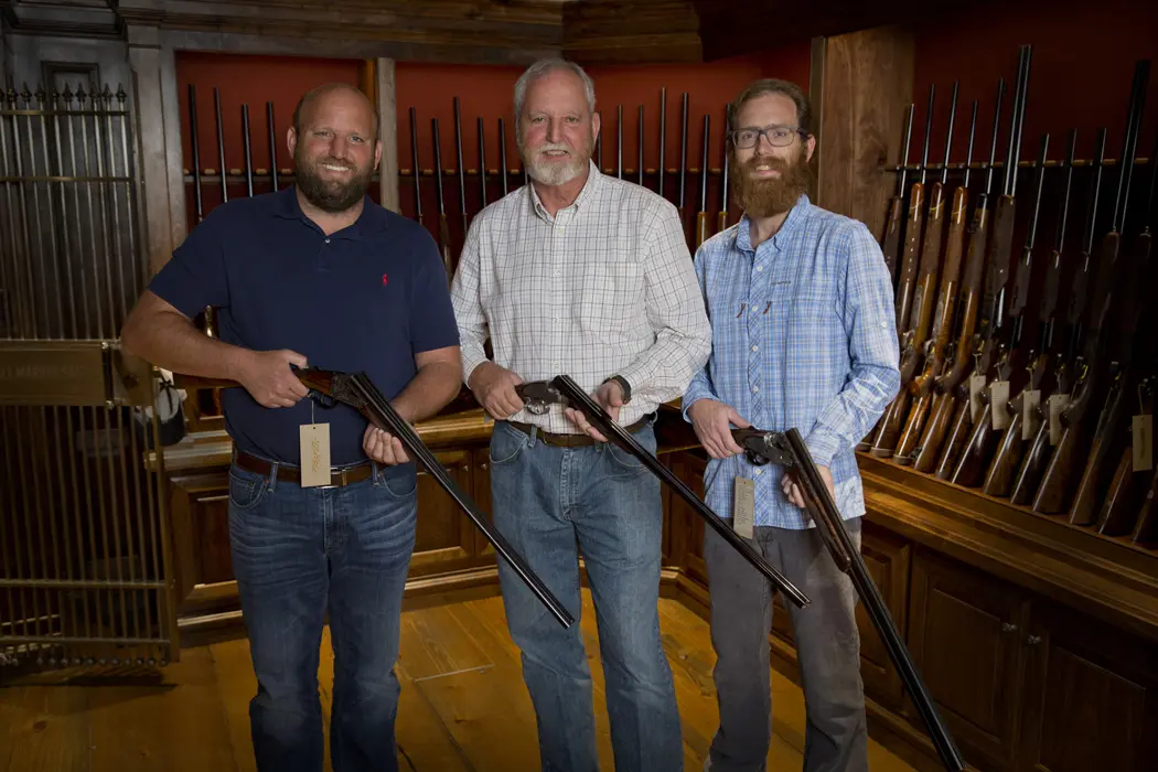 Shaun, Russell and Garrett Gordy in the gun vault in their Houston shop.