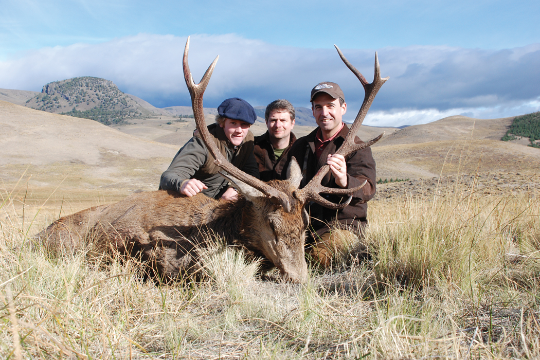 Three men posing with hunt