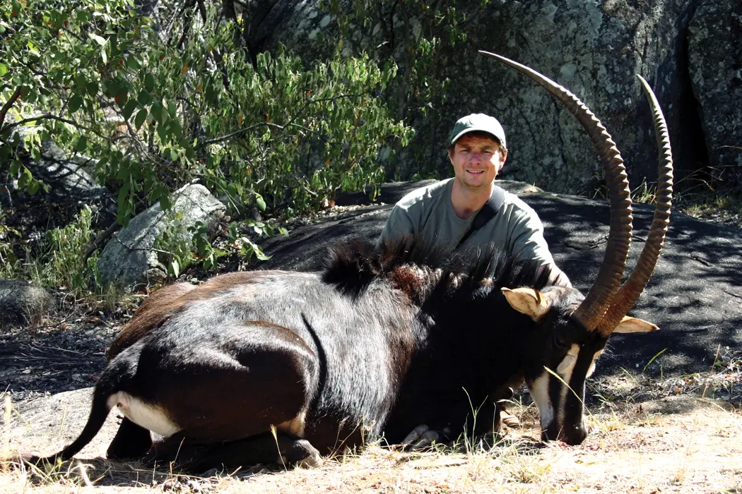 man posing with hunt