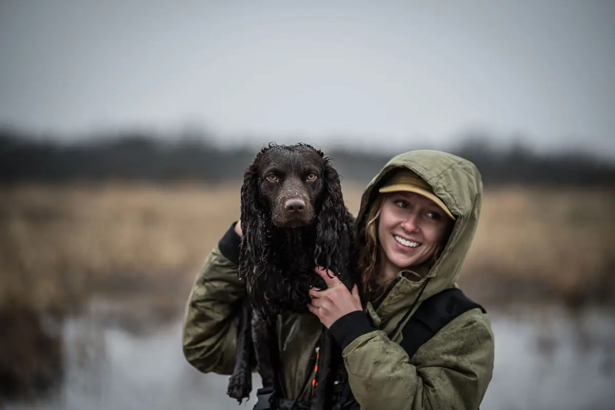 Hannah Criscoe of Whistling Wings Kennels and her Boykin spaniel Wheeler