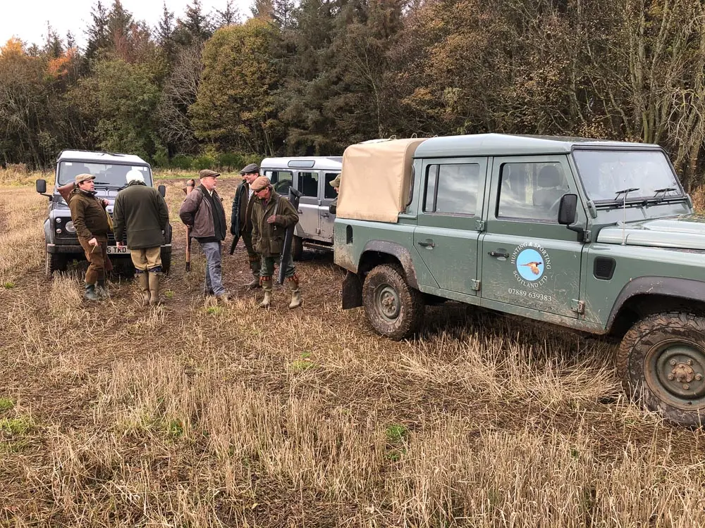 group of people with vehicles
