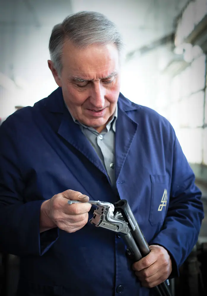 man cleaning gun