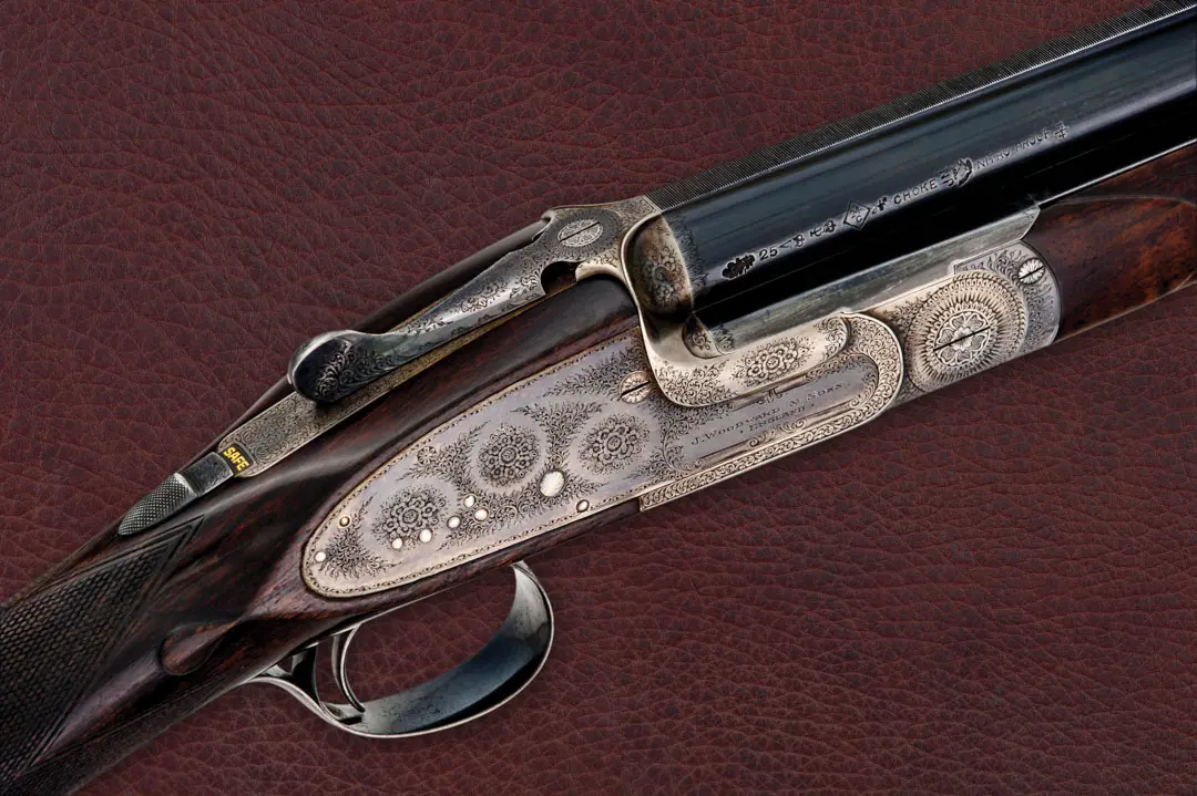 Beautiful Woodward gun on a leather background.