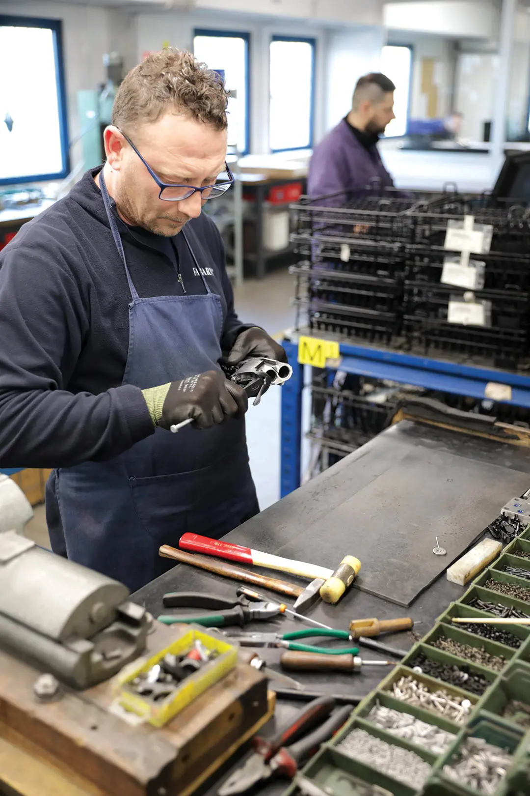 man working in a gun workshop