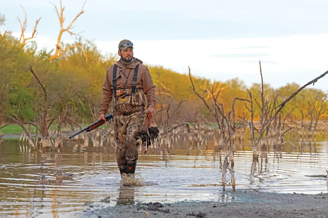 El Dorado Outfitters co-owner Jose Aleman returns to the blind with a brace of black-bellied whistling ducks.