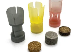 Collapsing cushioning posts in one-piece plastic wads and compressing fiber