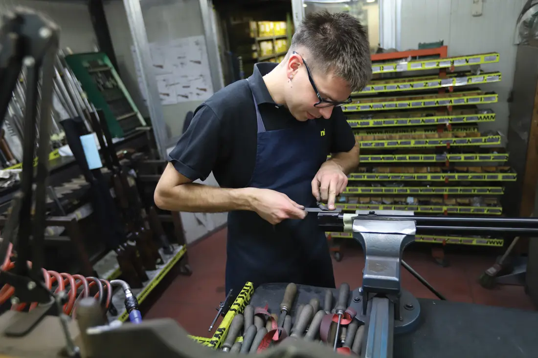 Man working on gun