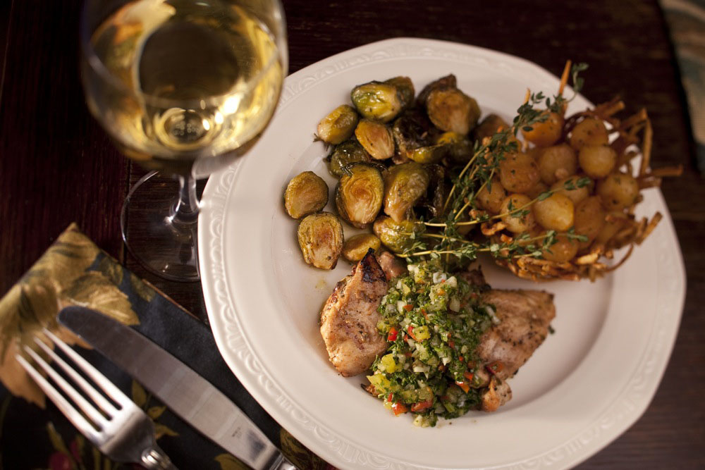Chukar Chimichurri with roasted brussel sprouts and a potato basket
